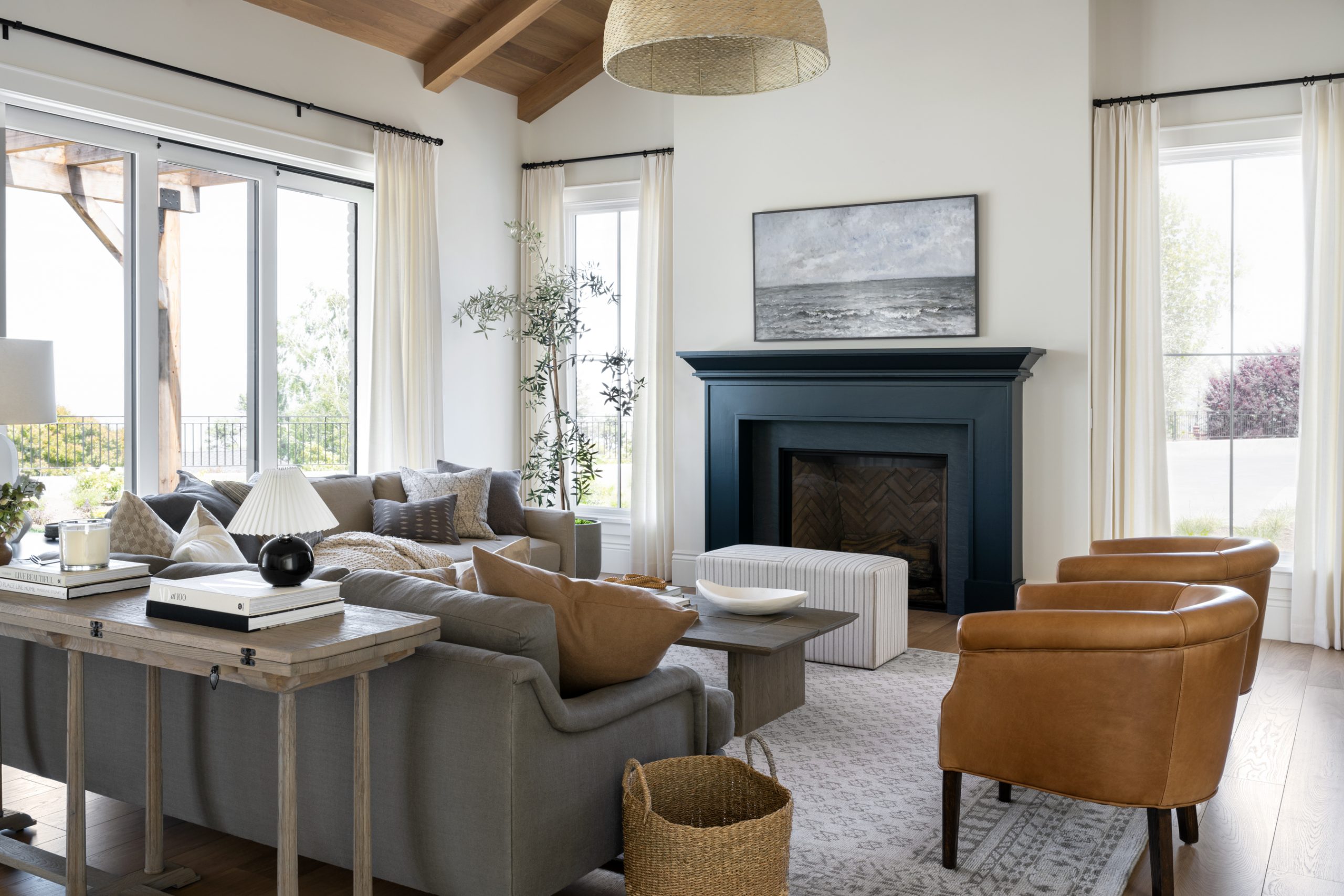 Living room with fireplace and woven pendant